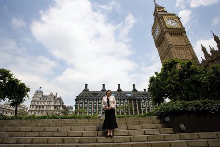 Clare Short standing outside the Houses of Parliament.